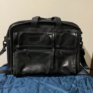 Black leather TUMI briefcase.